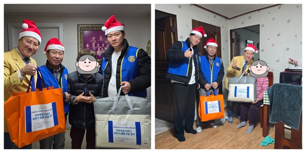 광교로타리클럽 회원들이 취약계층 어르신에게 혹한기 물품을 전달하고 있다.