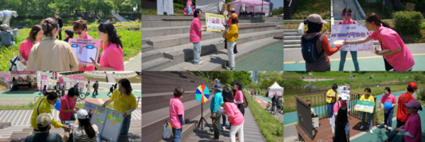 IWPG 평화 활동가들이 양재천에서 시민들에게 ‘세계여성평화의 날’ 캠페인 활동을 하고 있다.